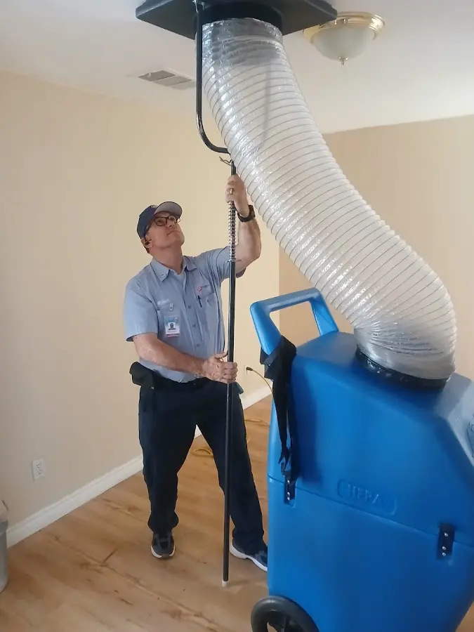 Furnace Tune-Up technician using HEPA equipment in Panama City